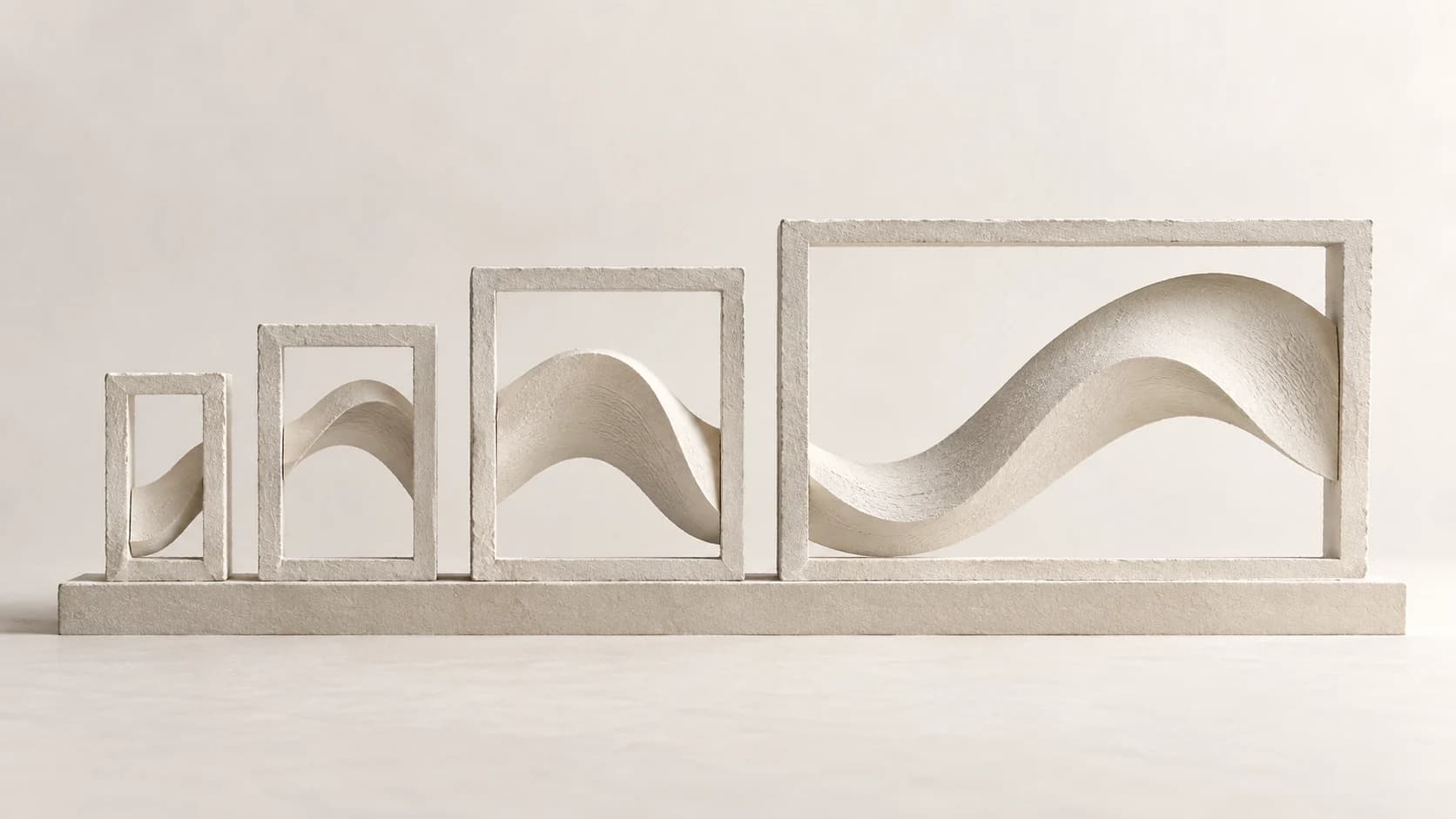 Four white sculptural frames of increasing size carrying one continuous wave